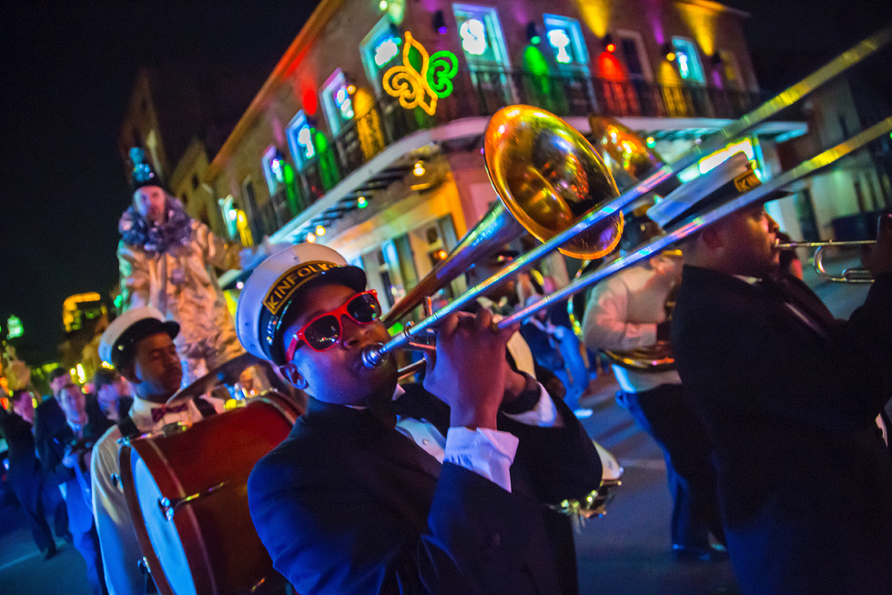Trumpet player marches down the streets of New Orleans during Mardi Gras.